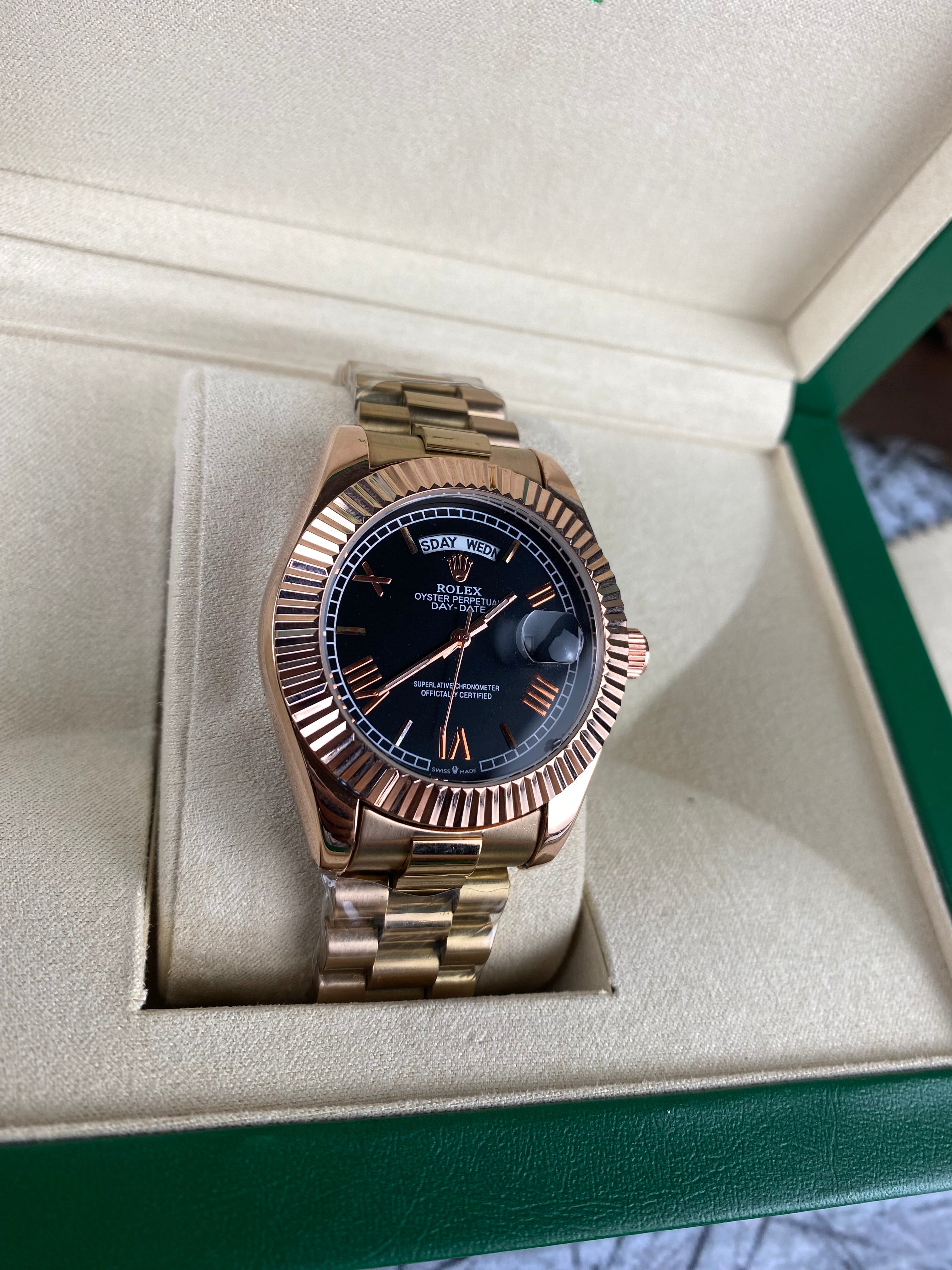 Rolex Day-Date 40 Everose gold with black dial